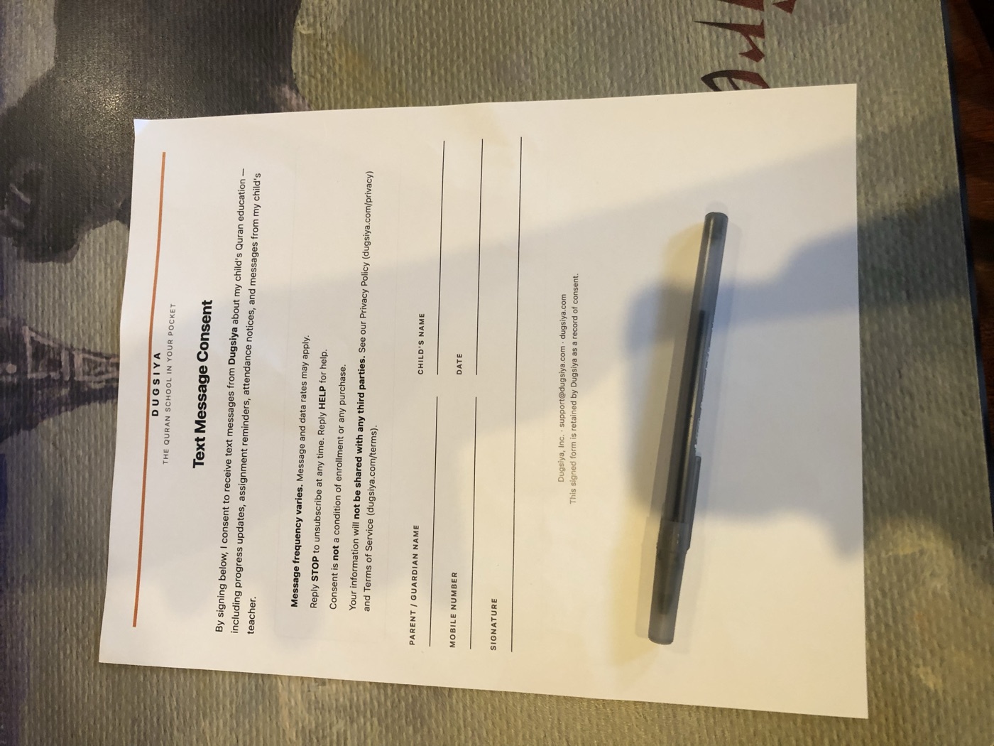 Dugsiya Text Message Consent form, signed in person by a parent at enrollment